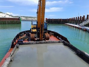 hopper barge transporting dredging spoil from Dover